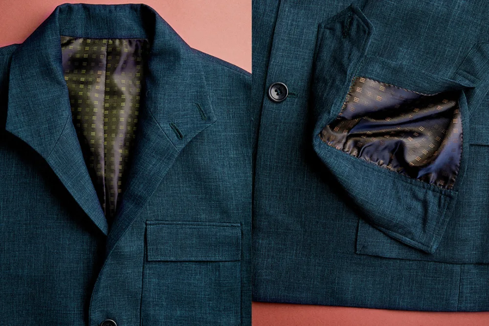 details of a green bespoke men's shacket on a red background